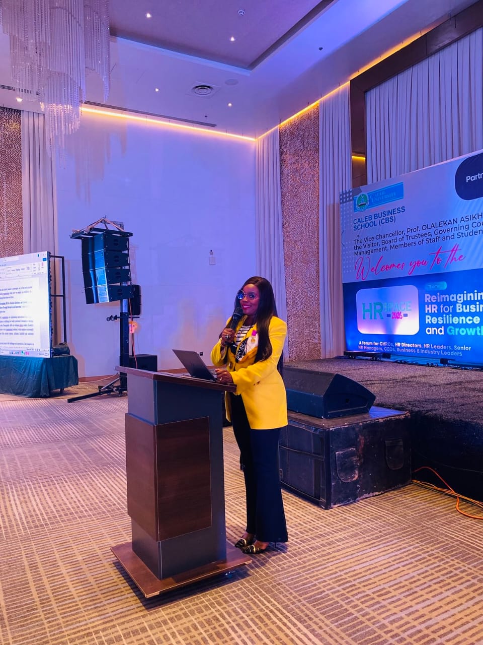 Abiola Laseinde speaking at Caleb Business School